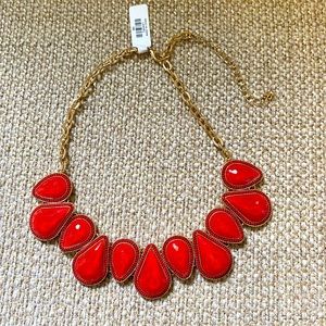 Francesca’s red jeweled necklace